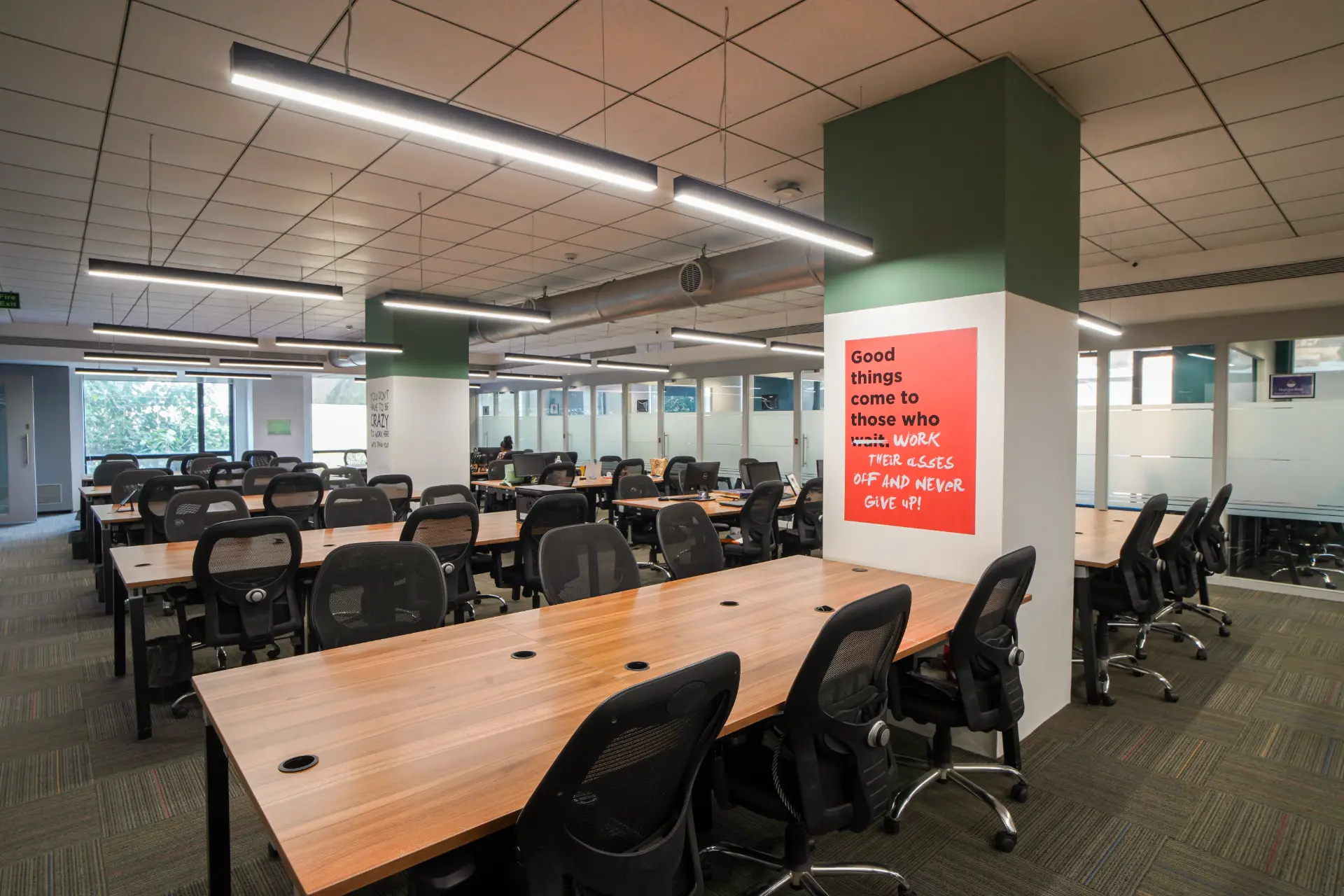 Shared Desks by the Red Wall at YesssWorks Andheri