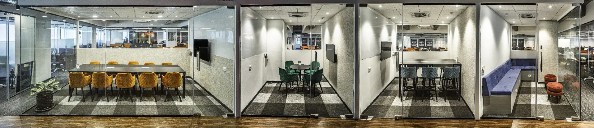 Row of Meeting Rooms and Discussion Pods at YesssWorks Goregaon