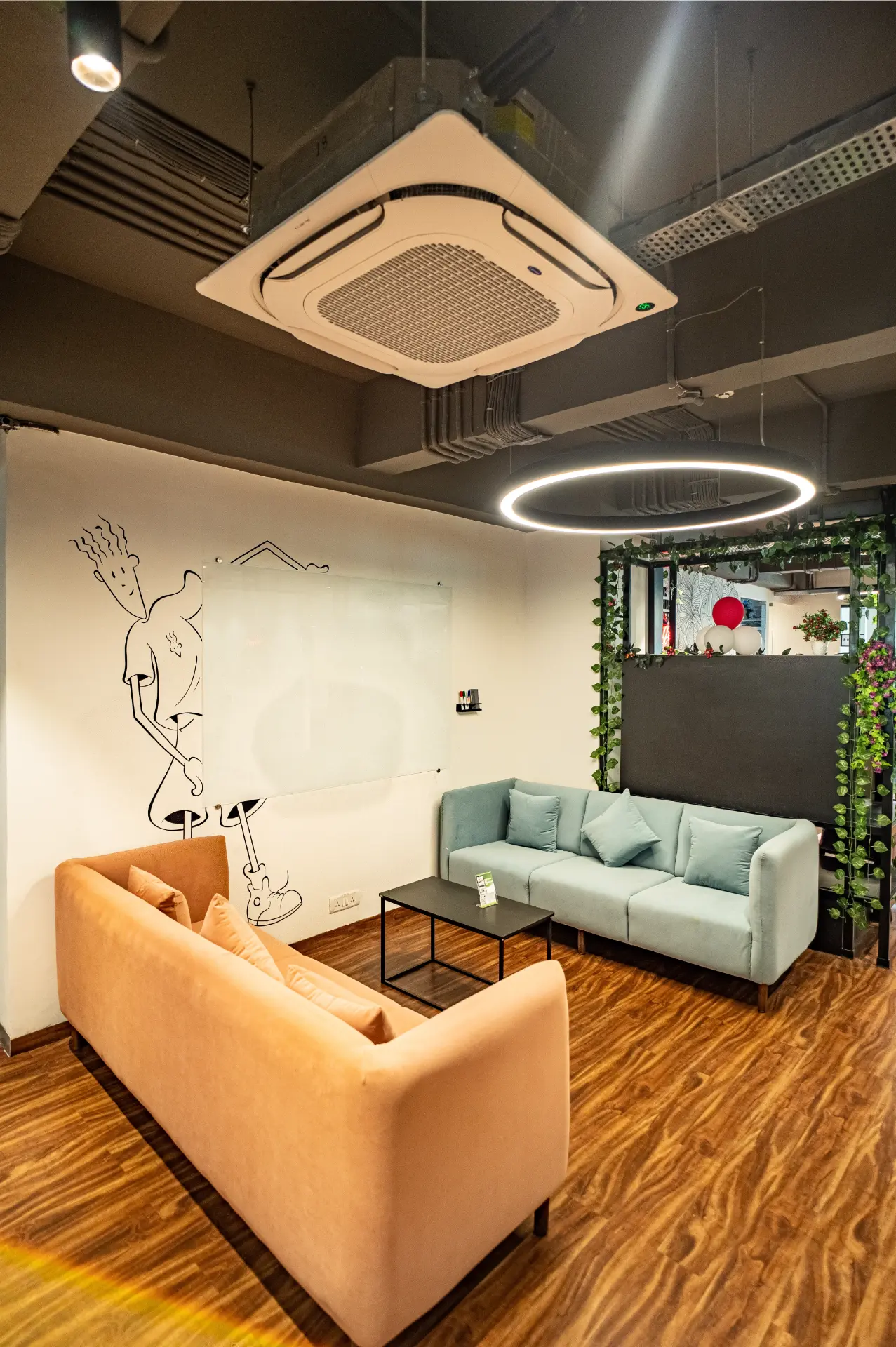 Quiet Sofa Corner Near the Green Trellis at YesssWorks Goregaon, 271 Business Park