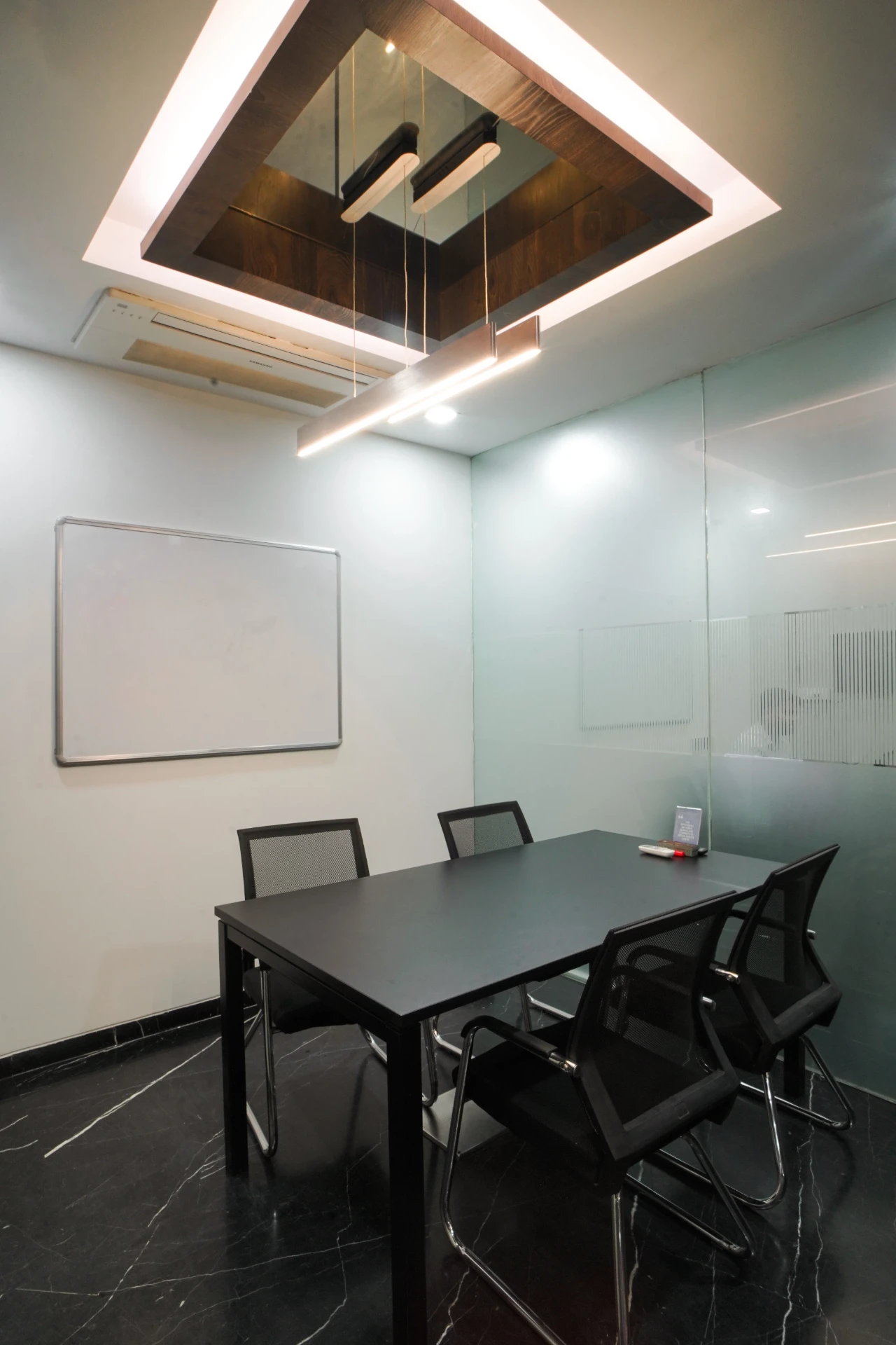 Four Seat Glass Meeting Room with Whiteboard at YesssWorks Andheri