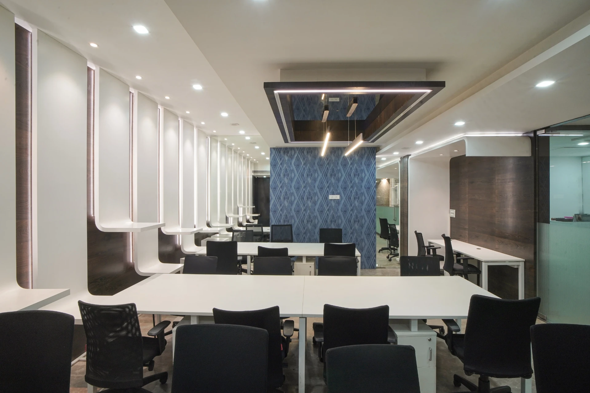 Team Table Under the Sculpted Wall Panels at YesssWorks Andheri