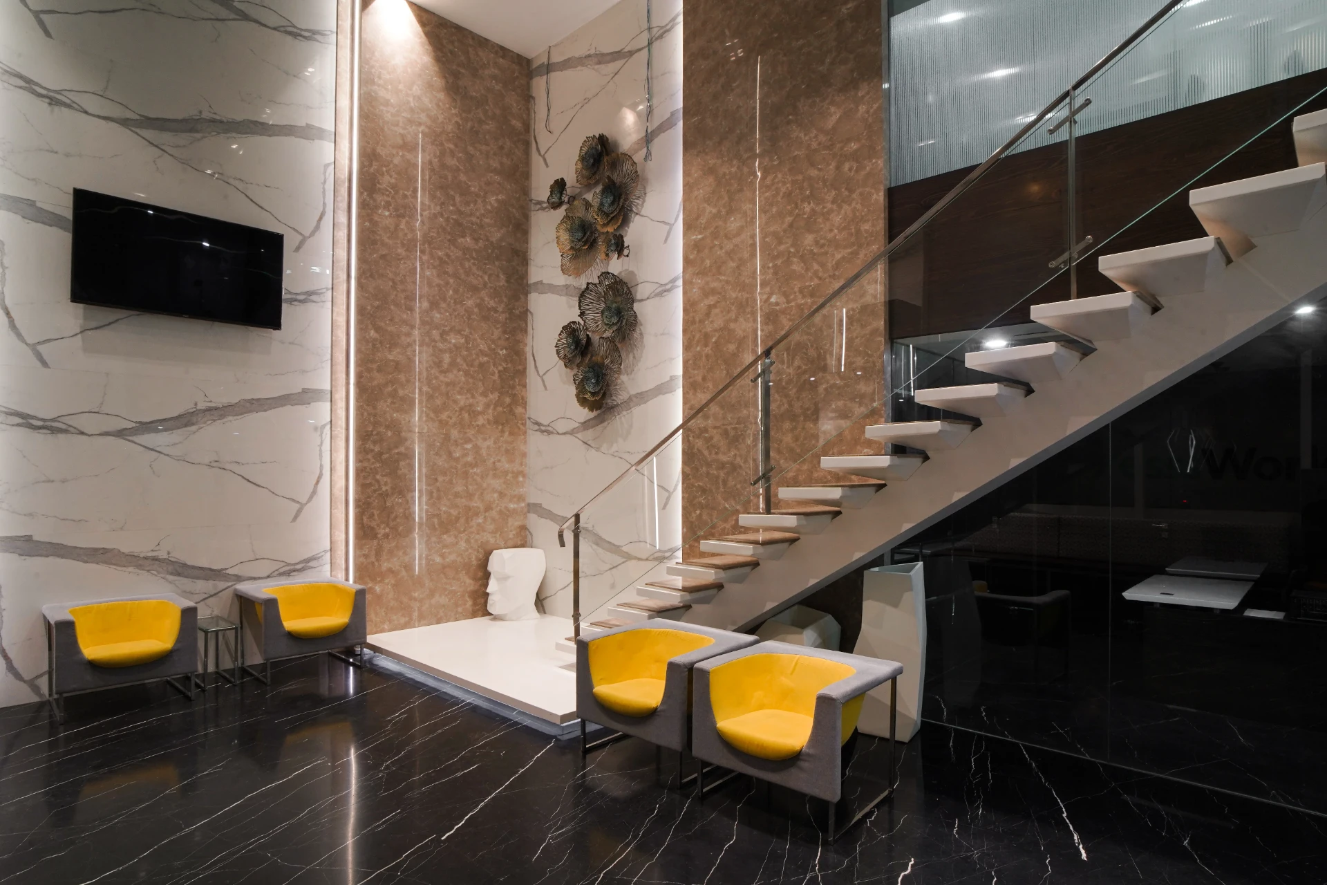 Marble Lobby Lounge with Yellow Chairs at YesssWorks Andheri
